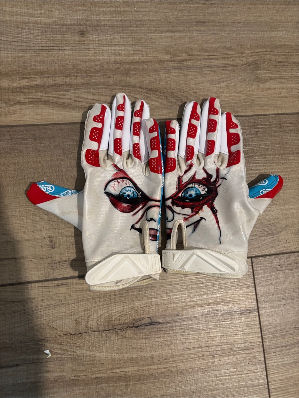 White Football Gloves with Red Accents and chucky Face Graphic